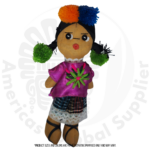Handcrafted Guatemalan folk doll made of fabric, wearing traditional indigenous clothing with a purple embroidered blouse, multicolored woven skirt, black braided hair, and colorful pom-pom decorations. The doll is displayed against a white background and represents traditional Guatemalan artisan craftsmanship.